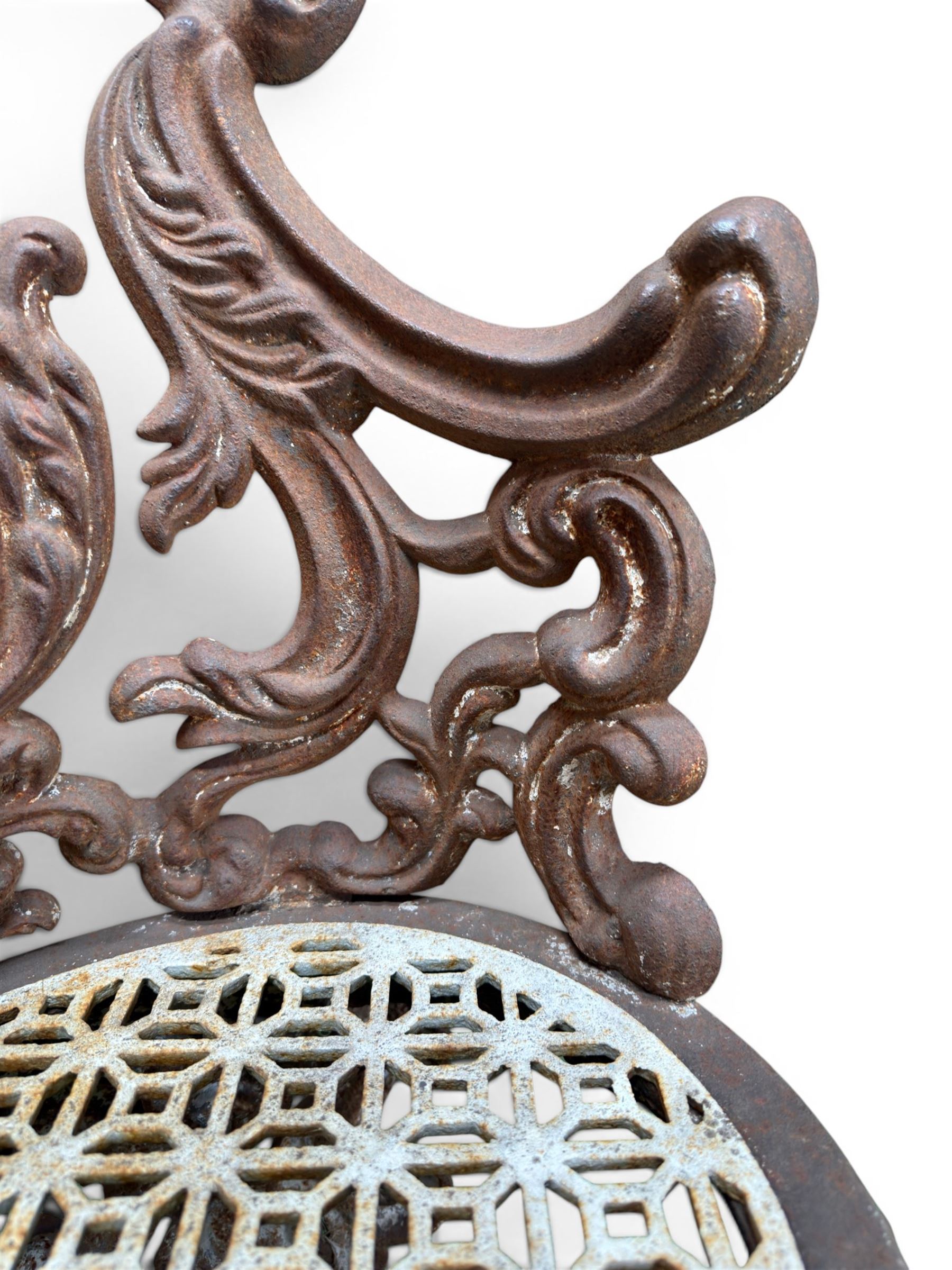 19th century Rococo Revival cast iron garden chair, pierced back comprised of scrolling acanthus leaves, over a pierced geometric white painted drop-in seat, raised on four acanthus and anthemion shaped cabriole supports united by X-frame stretcher