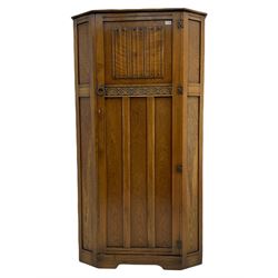 Early to mid 20th century oak hall wardrobe, single door with linenfold panel