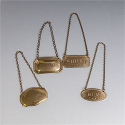 Five silver decanter labels, of varying design, including Bacardi, Vodka, Rum, Brandy and Whisky, all hallmarked together with two silver plated Gin and Sherry examples
