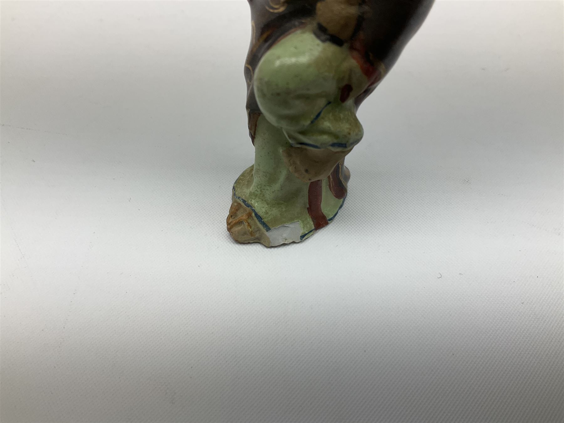 Japanese parquetry puzzle box L12cm; another Japanese puzzle box with marquetry top of Mount Fuji; eleven graduated Chinese figures including immortals; and Chinese figure of a lady standing on a hardwood base next to a horn table (14)