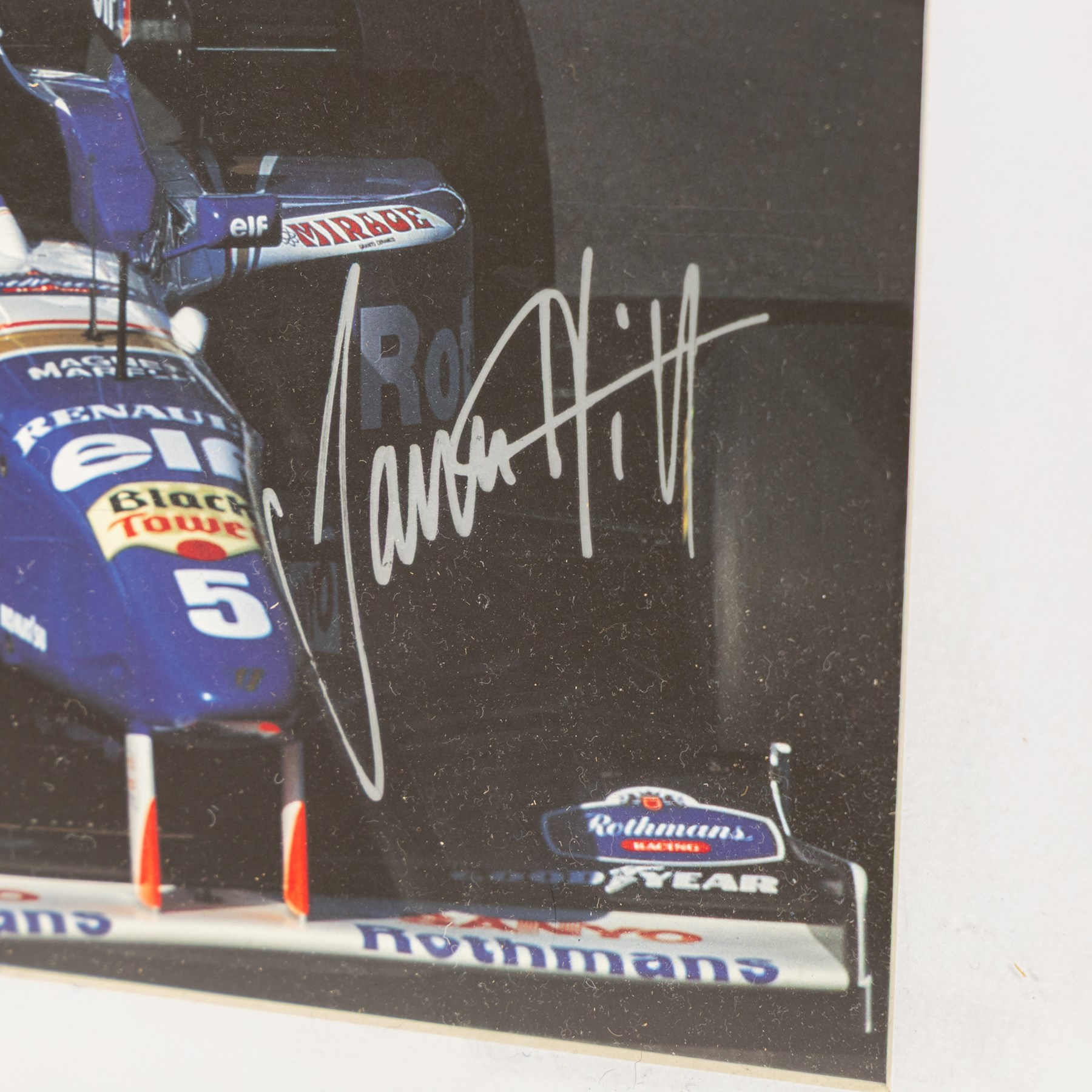 Ten signed Formula 1 photographs, comprising eight Damon Hill examples, Jenson Button and a Nigel Mansell example, nine with certificates of authenticity from Write Stuff Autographs, all framed, largest H47cm, W67cm