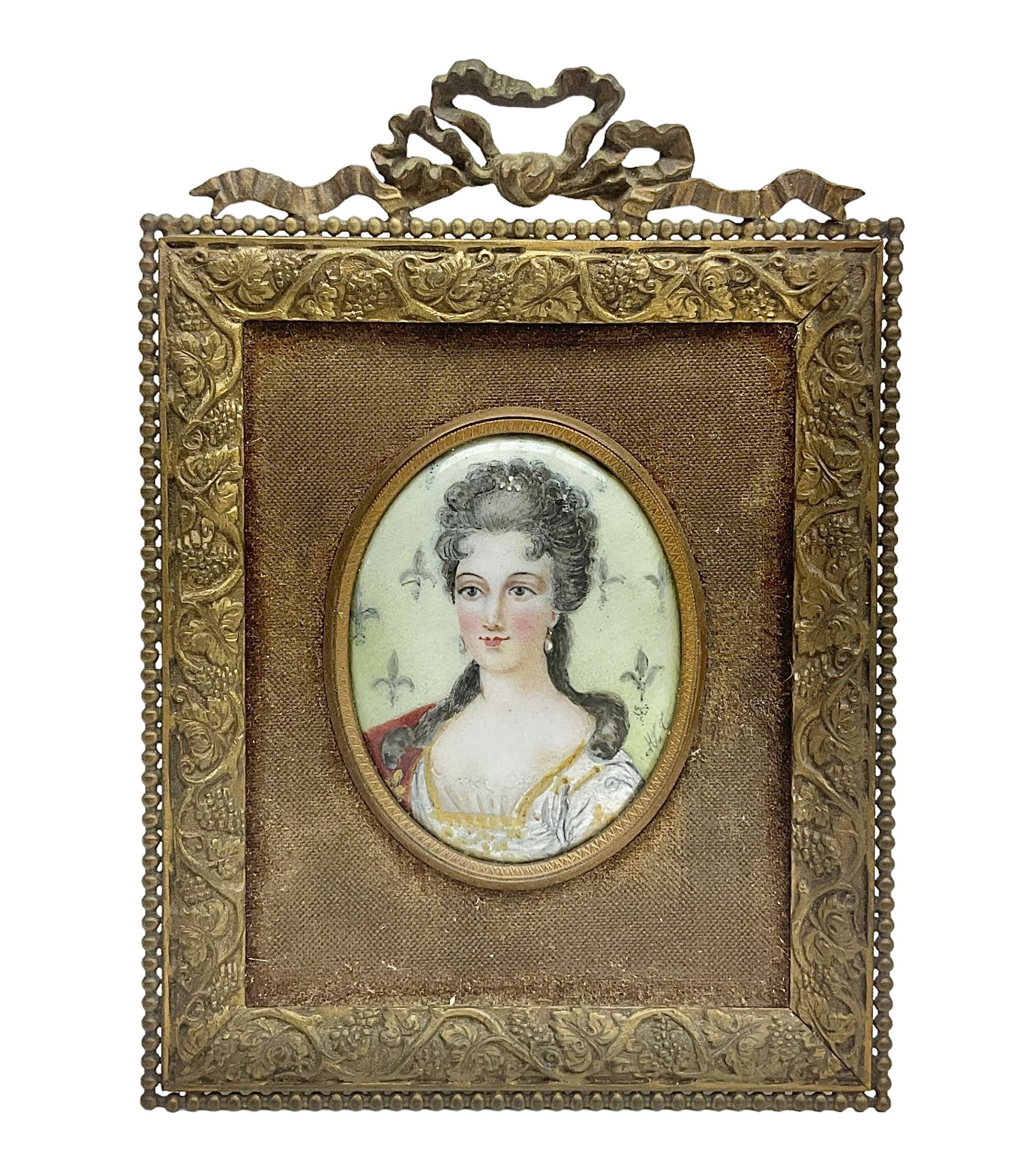 19th century portrait miniature on enamel, depicting a Georgian lady in period dress, hand painted with gilt detailing, in gilt frame with fruiting vine details, overall H13.7cm
