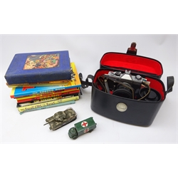  Praktica LTL 35mm camera outfit in carry case with booklets, two unboxed Corgi/Dinky die-cast military vehicles and quantity of children's annuals and other books  