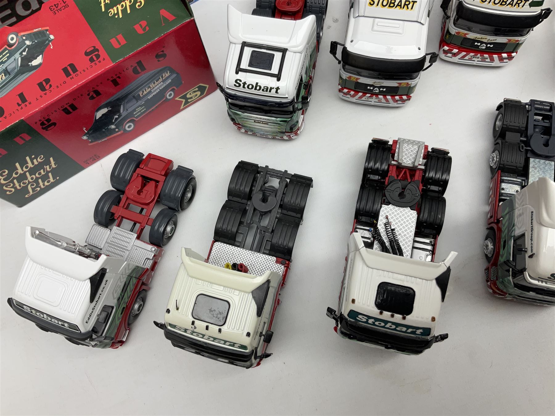 Eddie Stobart - three Oxford Die-Cast Super Rugby League lorries in perspex display cases including the two Hull Clubs; two Lledo Vanguard vans; two Days Gone vans; and Saico Truck & Trailer; all boxed; together with fourteen unboxed Corgi and other tractor/cab units etc (23)