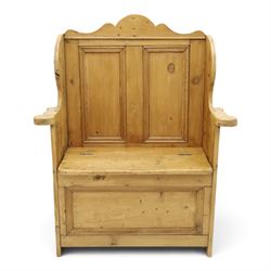 Victorian waxed pine settle or hall bench, shaped cresting rail over double panelled back, outswept arms on hinged box-seat, on end supports