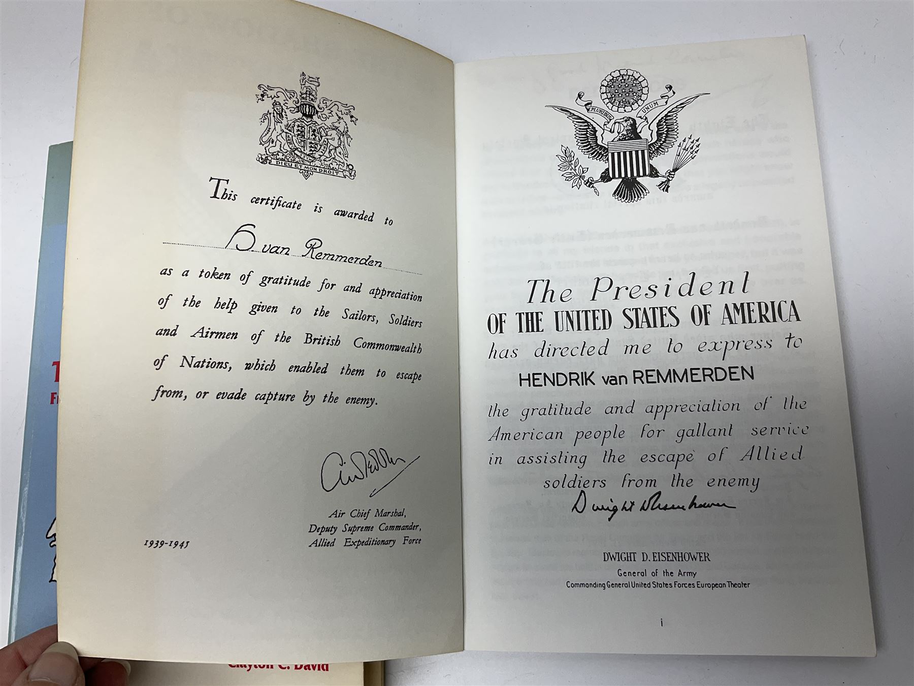 Two signed WWII books, comprising They Helped Me Escape: From Amsterdam to Gibraltar in 1944 by Clayton C.David, and In the Shadow of the Swastika by H. Van Remmerden
