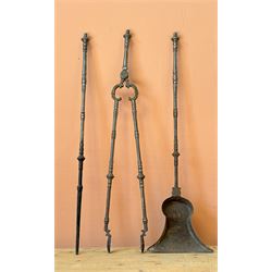 Trio of 19th century steel fire irons with urn finials, comprising tongs, poker, and shovel. L72cm.
