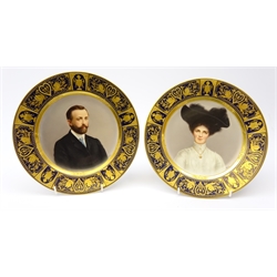  Pair 19th/ early 20th century Volkstedt cabinet plates painted with portrait busts of a lady and gentleman within gilt and cobalt blue borders, indistinctly signed D24cm   