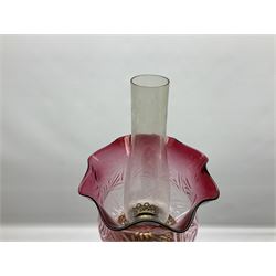 20th century Hawksworth, Eyre & Co silver plated oil lamp, the octagonal stepped base with engraved dedication, leading to an octagonal column supporting a faceted clear glass reservoir, Hinks Duplex burner, clear glass chimney, and cranberry glass shade, overall H71.5cm