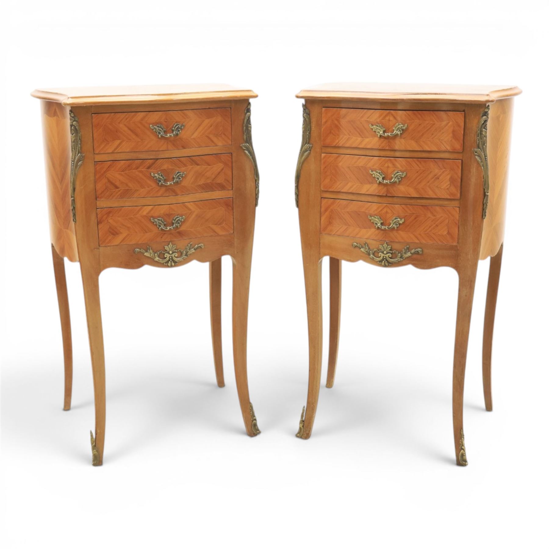 Louis XV style pair of kingwood bedside chests, each of serpentine outline with three parquetry drawers, gilt metal mounts and handles, raised on slender cabriole legs