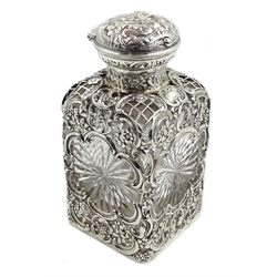  Edwardian silver mounted cut glass square decanter with star cut sides, pierced and embossed decoration with hinged push button lid, by William Comyns & Sons, London 1905  