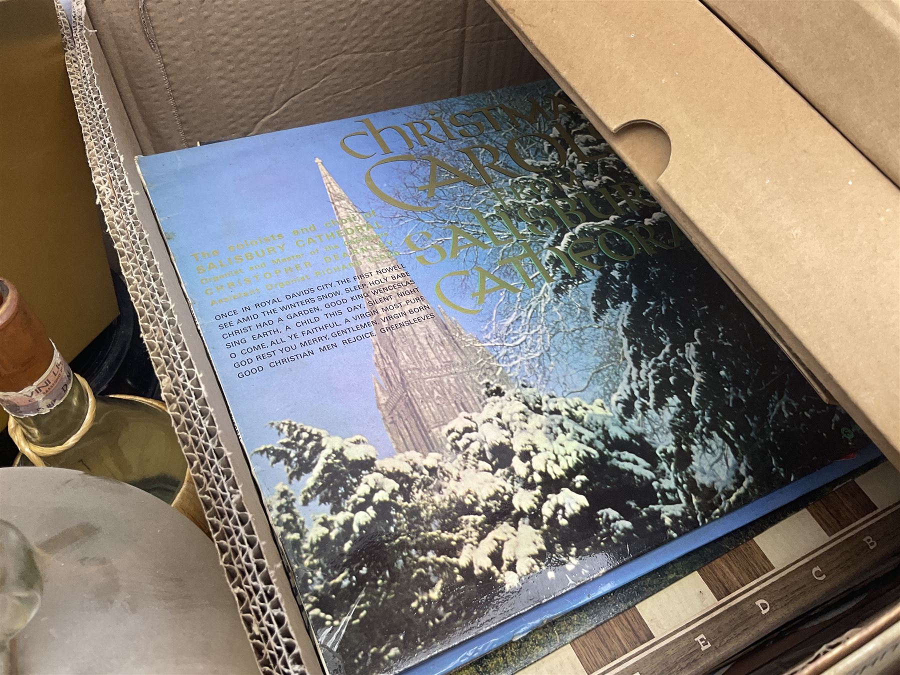 Clear glass demijohn / carboy, four wine bottles with wicker baskets, W T Avery & Co scales, Singer sewing machine, quantity of costume jewellery, trophy stand with silver-plate shields, quantity of vinyl records, stamps etc