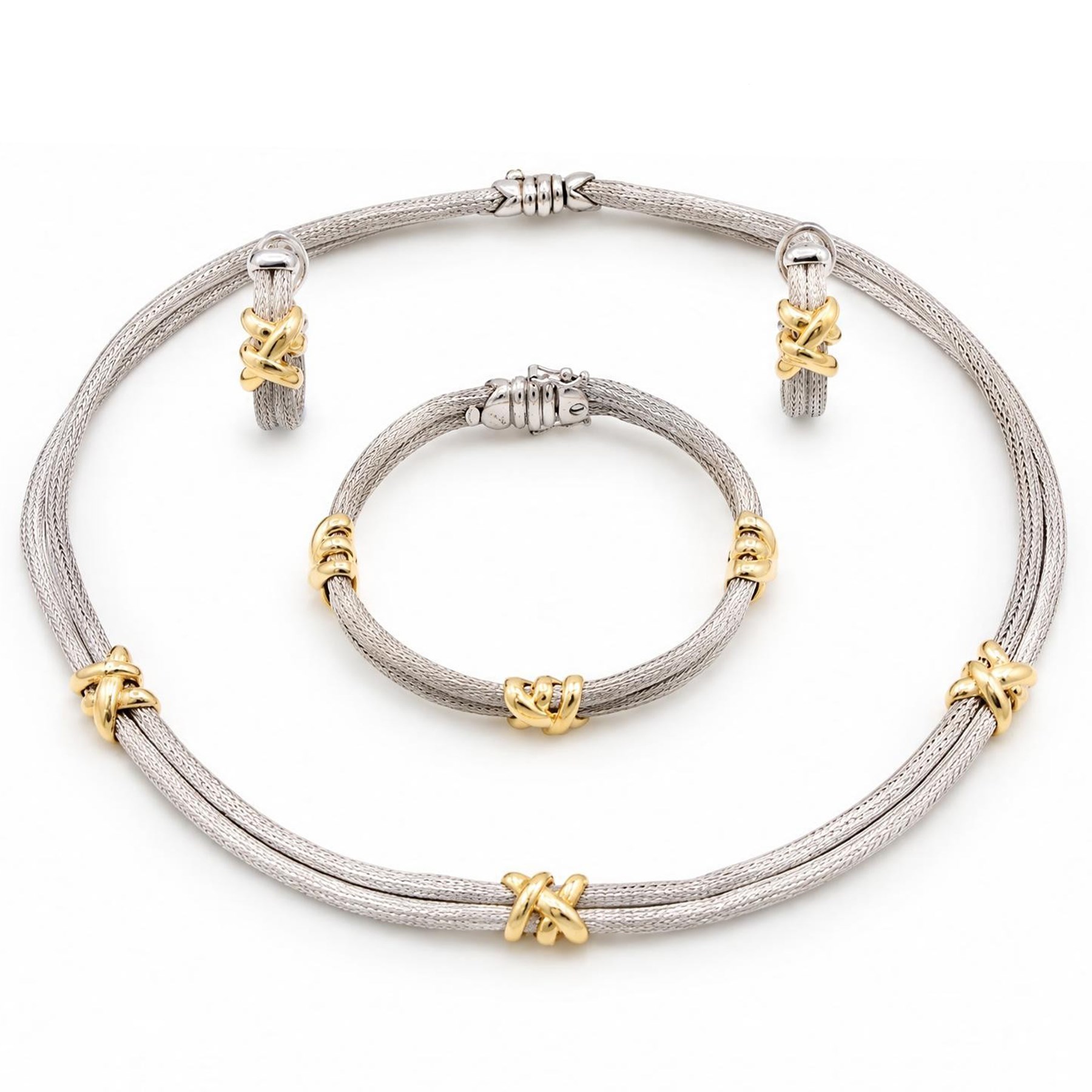 Silver and 18ct gold necklace, bracelet and earrings, two rows of silver mesh, spaced by gold cross motifs, retailed by Mappin & Webb, boxed