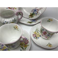 Shelley Wild Flowers pattern part tea service, comprising four cups and saucers, four dessert plates, cake plate, milk jug and open sucrier