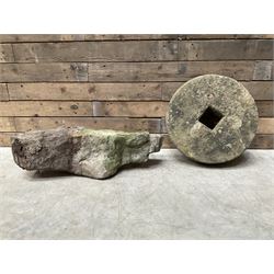 Rustic stone pedestal table, with circular mill wheel top