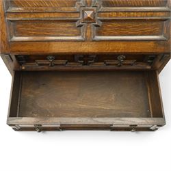 Early 20th century Jacobean Revival oak bureau-bookcase, astragal glazed doors enclosing two adjustable shelves, over geometric panelled fall-front enclosing fitted interior, over two drawers, raised on a spiral-turned base with barley-twist stretchers and compressed bun feet