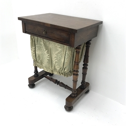  Victorian rosewood sewing table, rectangular top over single drawer with sliding bag beneath, four turned pillar supports on sledge platforms connected by stretcher, turned feet with internal castors, W57cm, H71cm, D39cm  