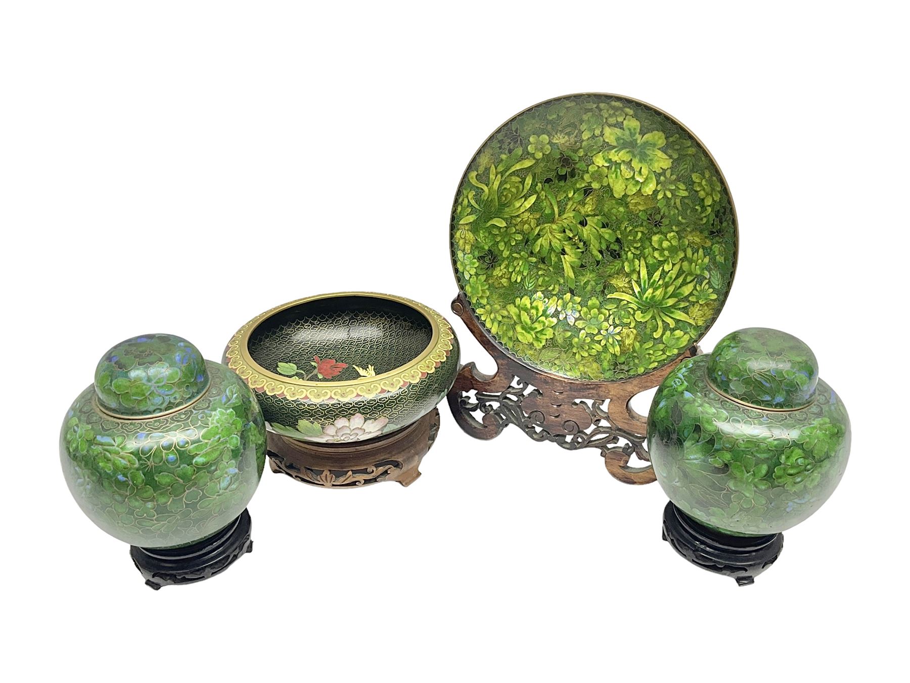 Pair of modern cloisonne ginger jars having floral decoration with a green ground, with hardwood stands, together with a similar plate and a bowl decorated with birds and flowers  