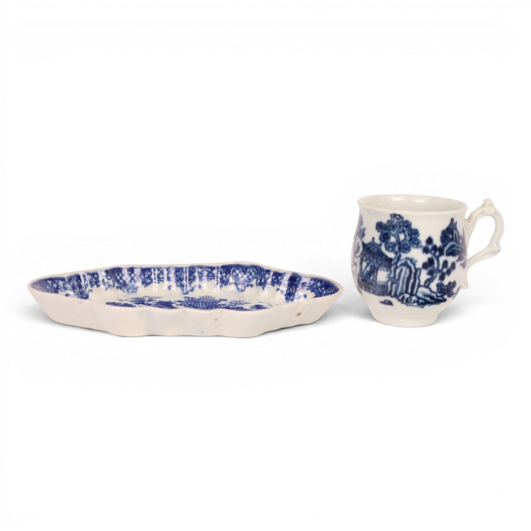 Worcester blue and white spoon tray, decorated in the Argument pattern, circa 1780-1785, L16cm, together with a Worcester blue and white bell shaped coffee cup with moulded scroll handle, decorated in the Man in the Pavilion pattern, circa 1760-1765, H6cm