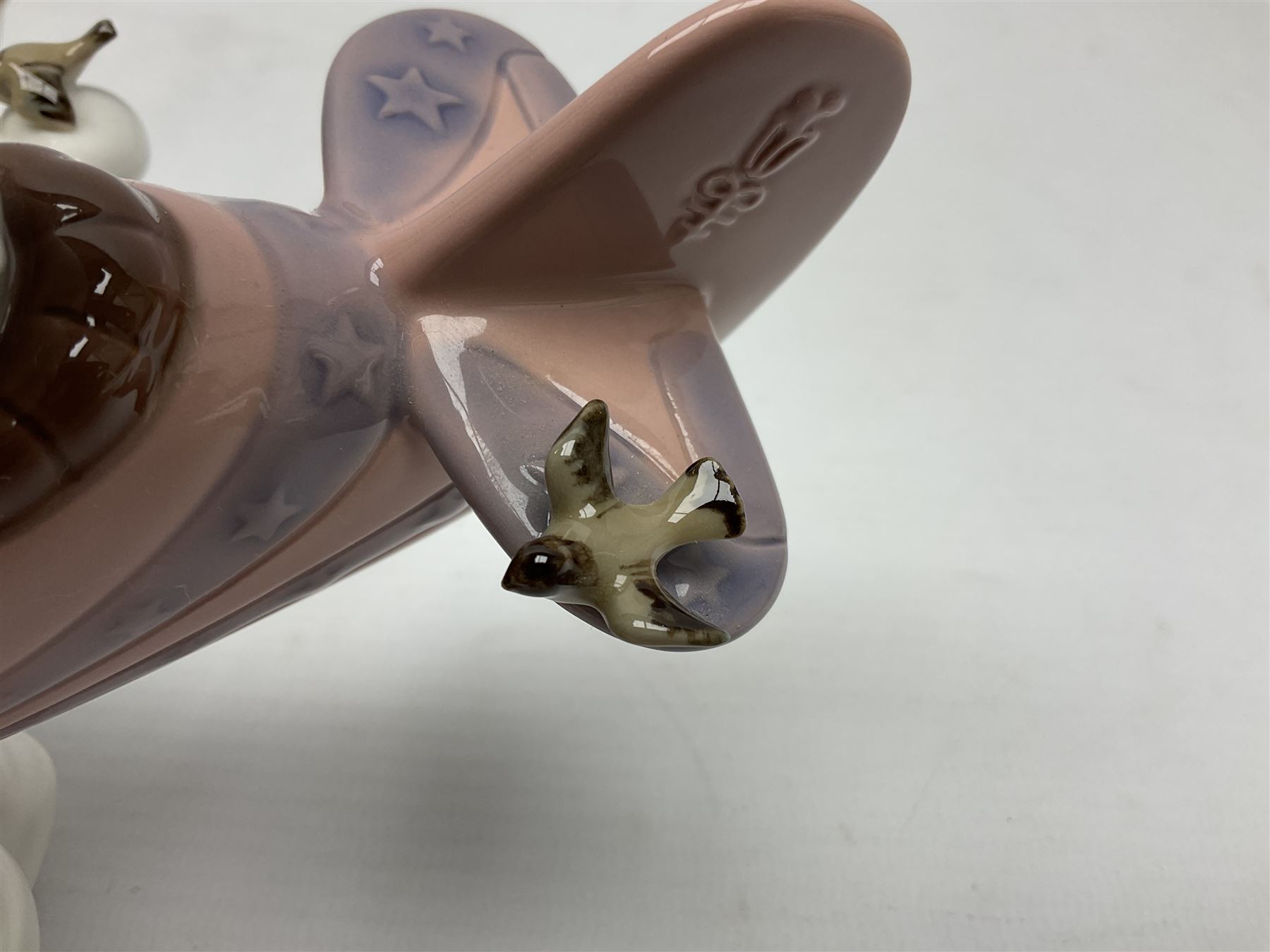 Lladro figure, Don't Look Down, modelled as a girl and boy in a plane, sculpted by Joan Coderch, no 5698, year issued 1990, year retired 2004, H17cm