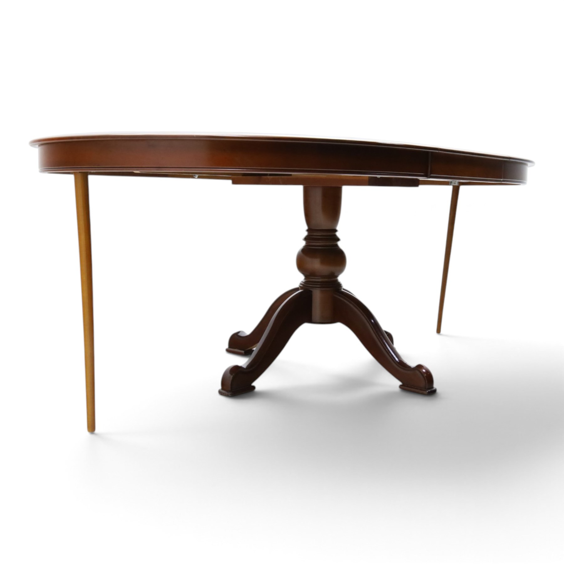 Barker & Stonehouse - cherrywood oval extending dining table and four upholstered chairs, the table with additional leaf extended to cm, raised on a turned column above swept supports, the chairs with brown upholstery and multi-coloured geometric design