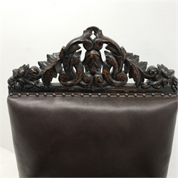 Jacobean style oak library chair, floral carved and pierced cresting rail, upholstered back seat and arms, barley twist supports (W68cm) and a similar oak hall chair, carved cresting rail and supports, upholstered back and seat (W52cm)