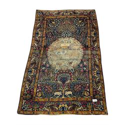 Late 19th/early 20th century Persian Tree of Life rug, blue ground with circular cartouche depicting animals and birds in landscape, the field with trailing tree of life motif decorated with flower heads, repeating design border