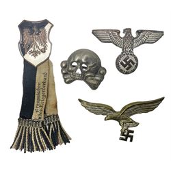 Imperial German Prussian Army Service Veterens Association badge; 'SS' type first pattern cap skull; Luftwaffe metal eagle uniform insignia; and another metal eagle cap insignia (possibly police?) (4)