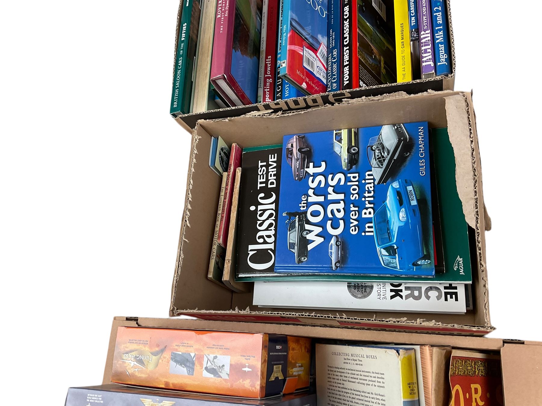 Corgi 'Aviation Archive' toys and classic car and other reference books in three boxes 