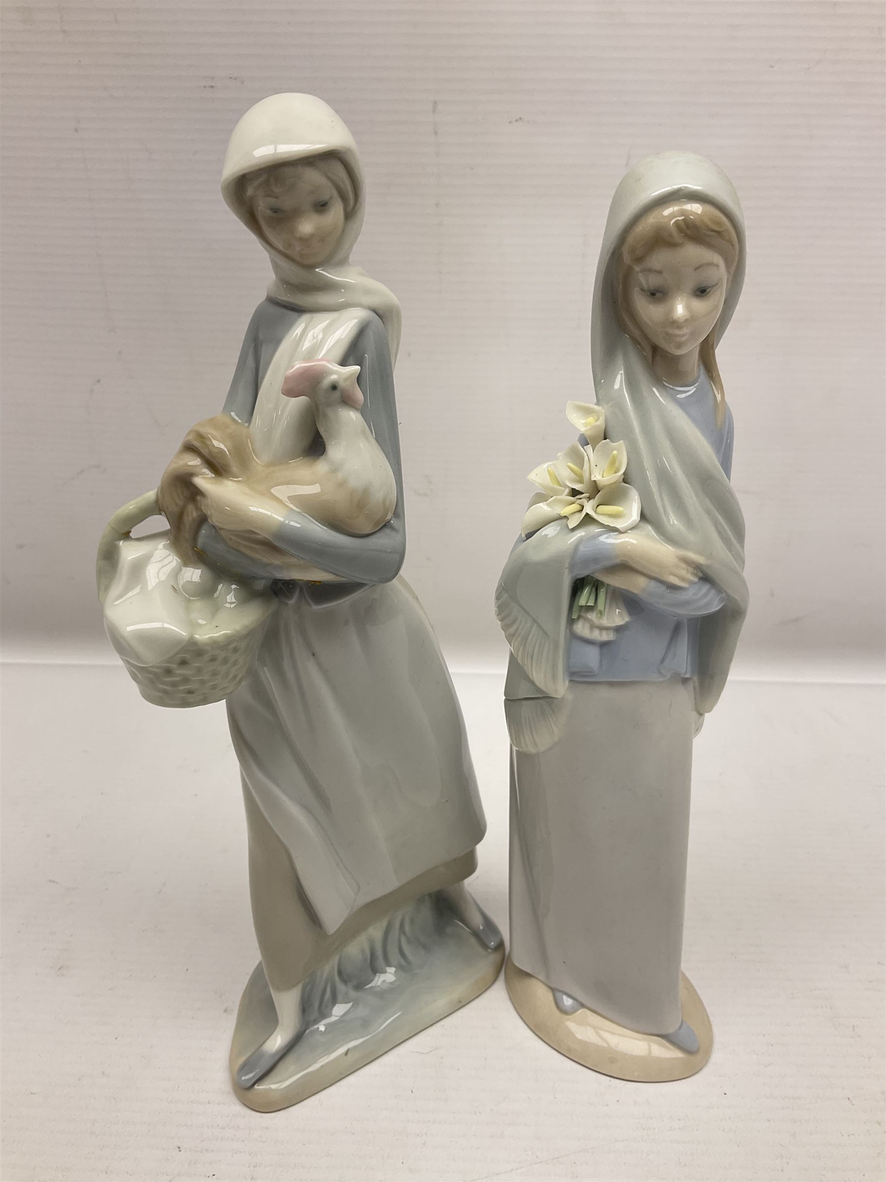 Four Lladro figures, including Girl With Cockerel no 4591, Gres Lonely no 2076 etc together with Nao figure 