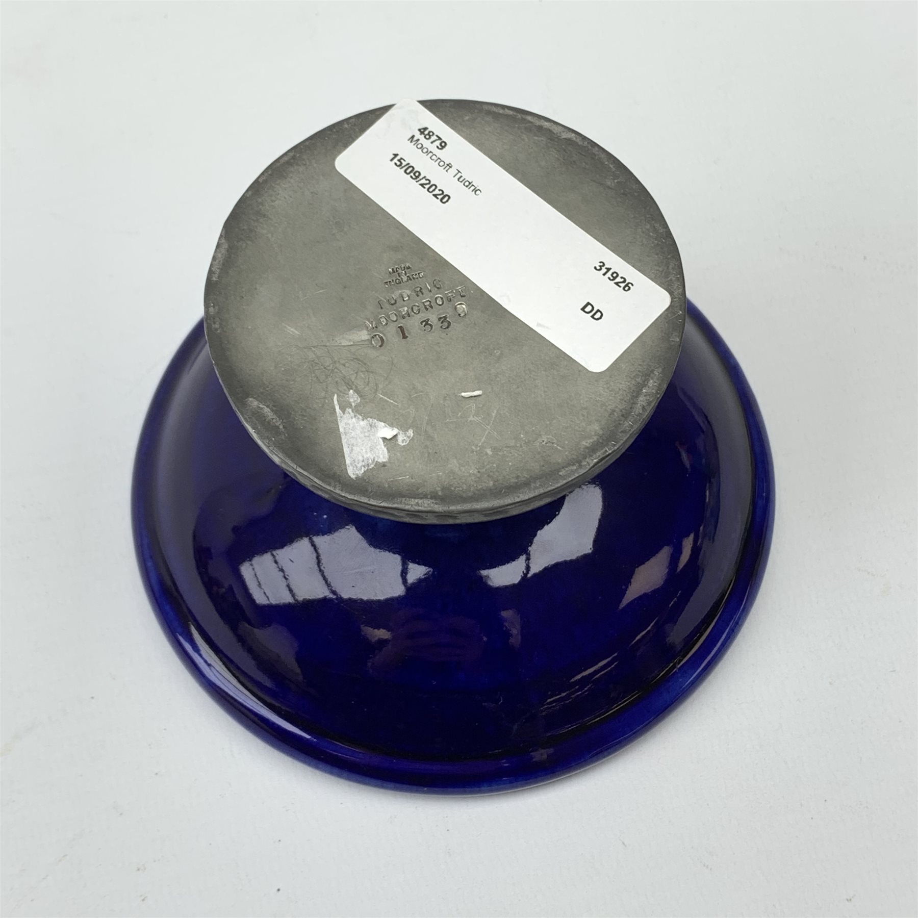 William Moorcroft for Liberty & Co, small pedestal dish, the shallow bowl decorated in the Moonlit Blue pattern, raised upon a Tudric pewter base, impressed beneath Made in England, Tudric Moorcroft 01339, H7cm, D11cm