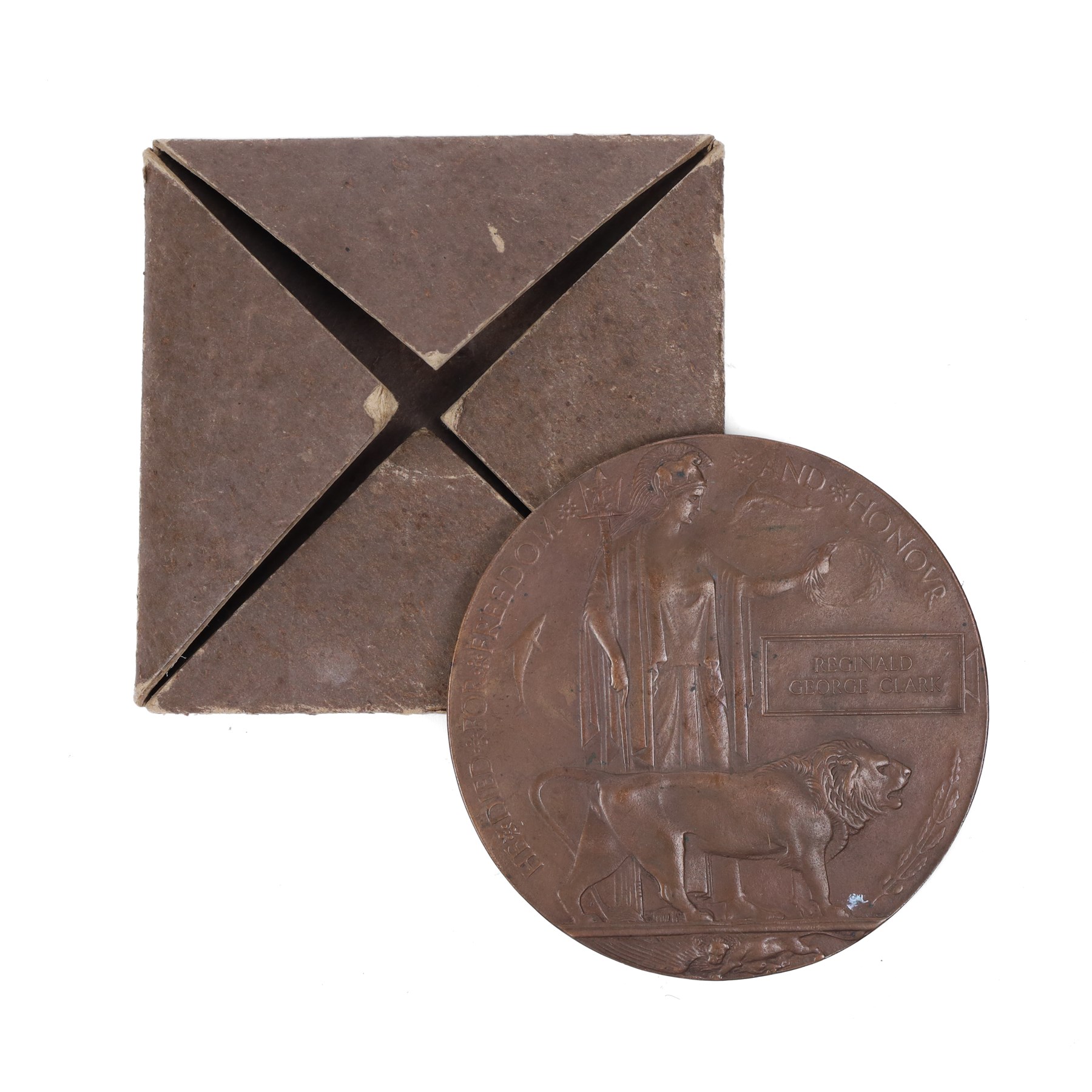 WWI bronze death plaque for Reginald George Clark, with card holder 