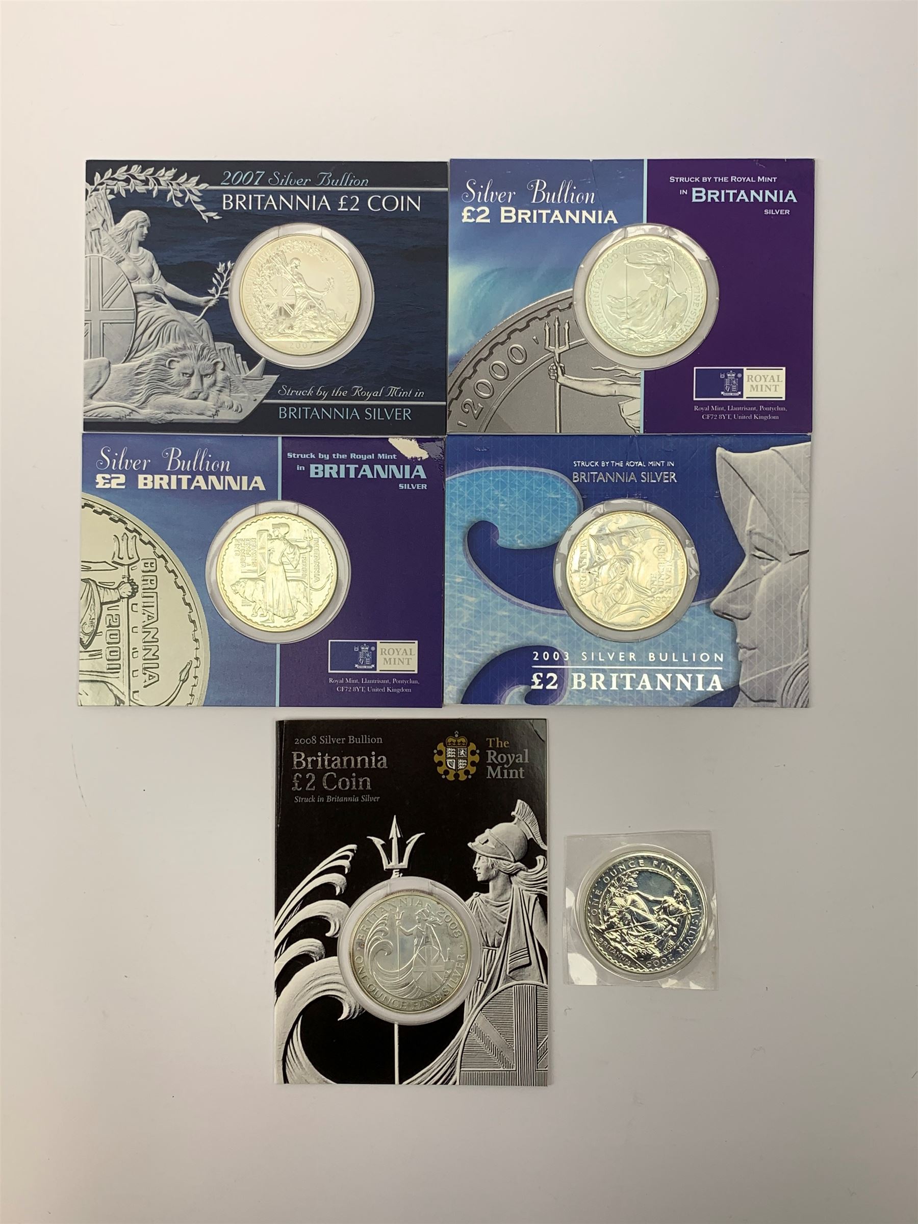 Six silver bullion two pound Britannia coins, each containing one troy ounce of fine silver, 2000, 2001, 2003, 2005, 2007 and 2008, all except 2005 on card holders