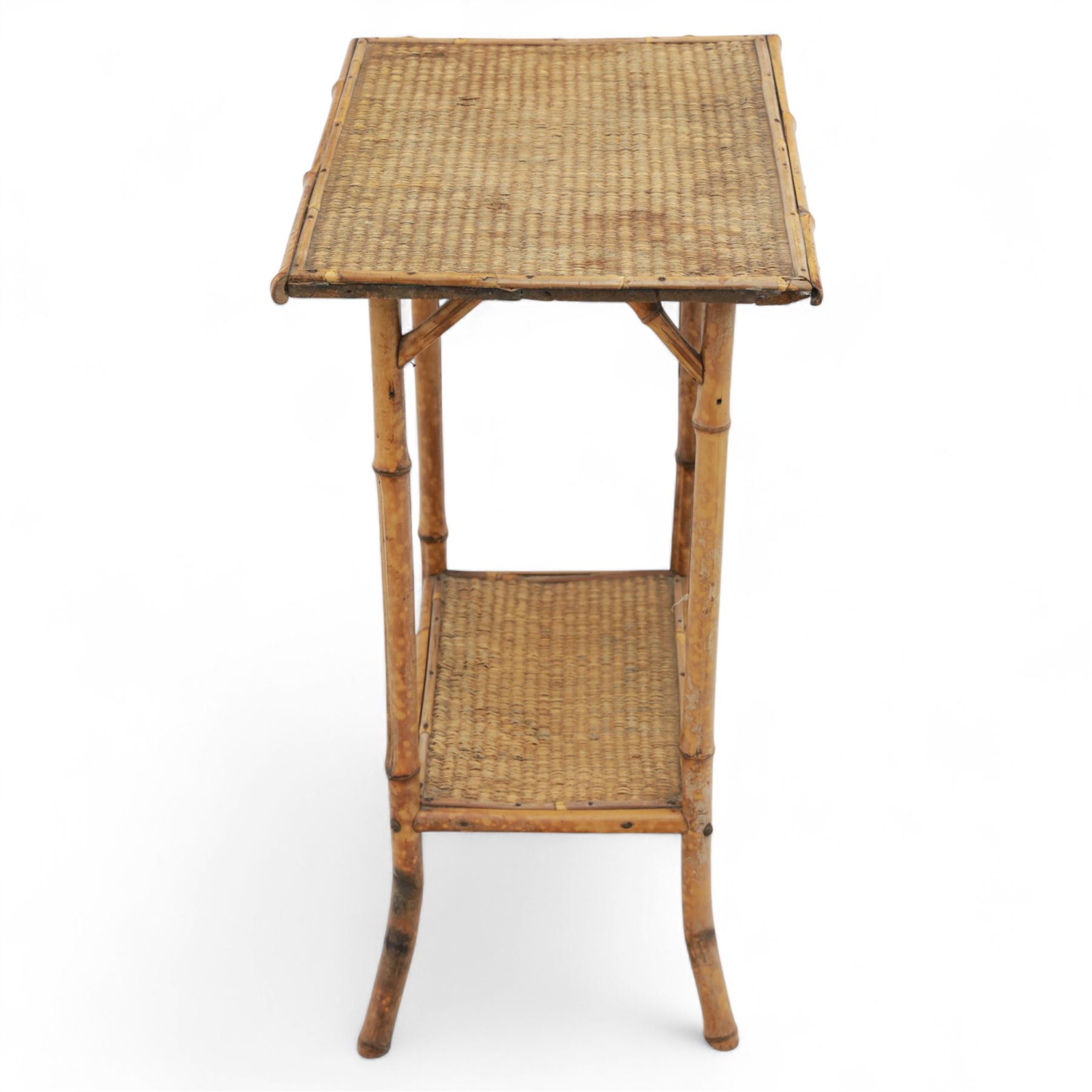 Early 20th century mahogany side table; with bedside cabinet, shaped rectangular top on barley twist supports united by stretchers (H 72cm, W 42cm, D 45cm), together with a Late Victorian tiger bamboo occasional table, rectangular two-tier form with woven cane surfaces, the upper tier with raised edge above splayed supports with naturalistic jointing (H 70cm, W 52cm, D 36cm)