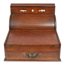 Victorian oak perpetual calendar roll-top desk, tambour front enclosing fitted interior with pigeonholes and pen trays, the raised back fitted with rotating date and month apertures, over single frieze drawer with cast brass handle, on plinth base