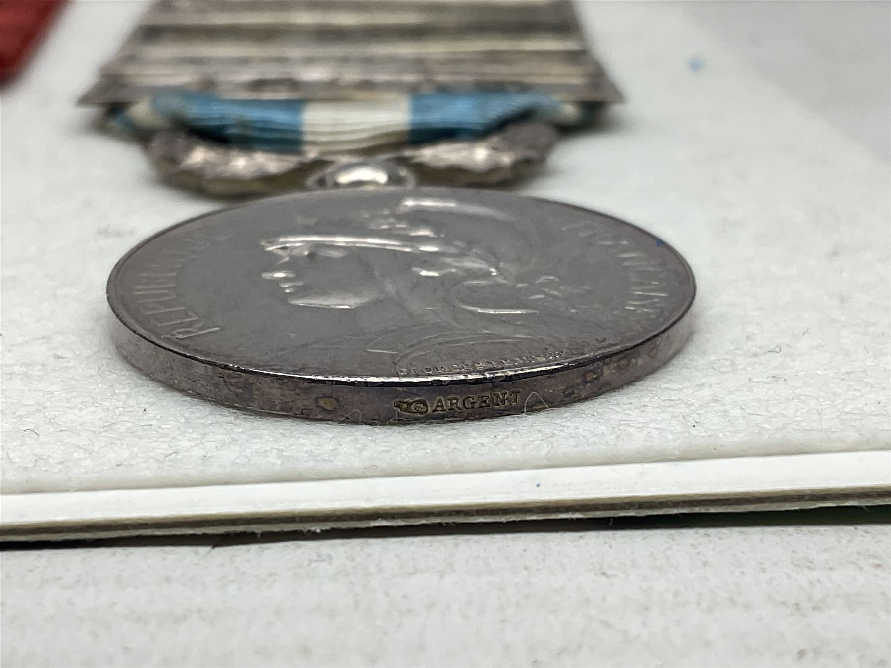 French Republic Colonial Medal with five clasps for Libye, Afrique Francaise Libre, Bir Hakeim, Koufra and Tchad; and Croix de Guerre Des Theatres D'Operations Exterieurs with three MID leaves and gold star; both with ribbons (2)