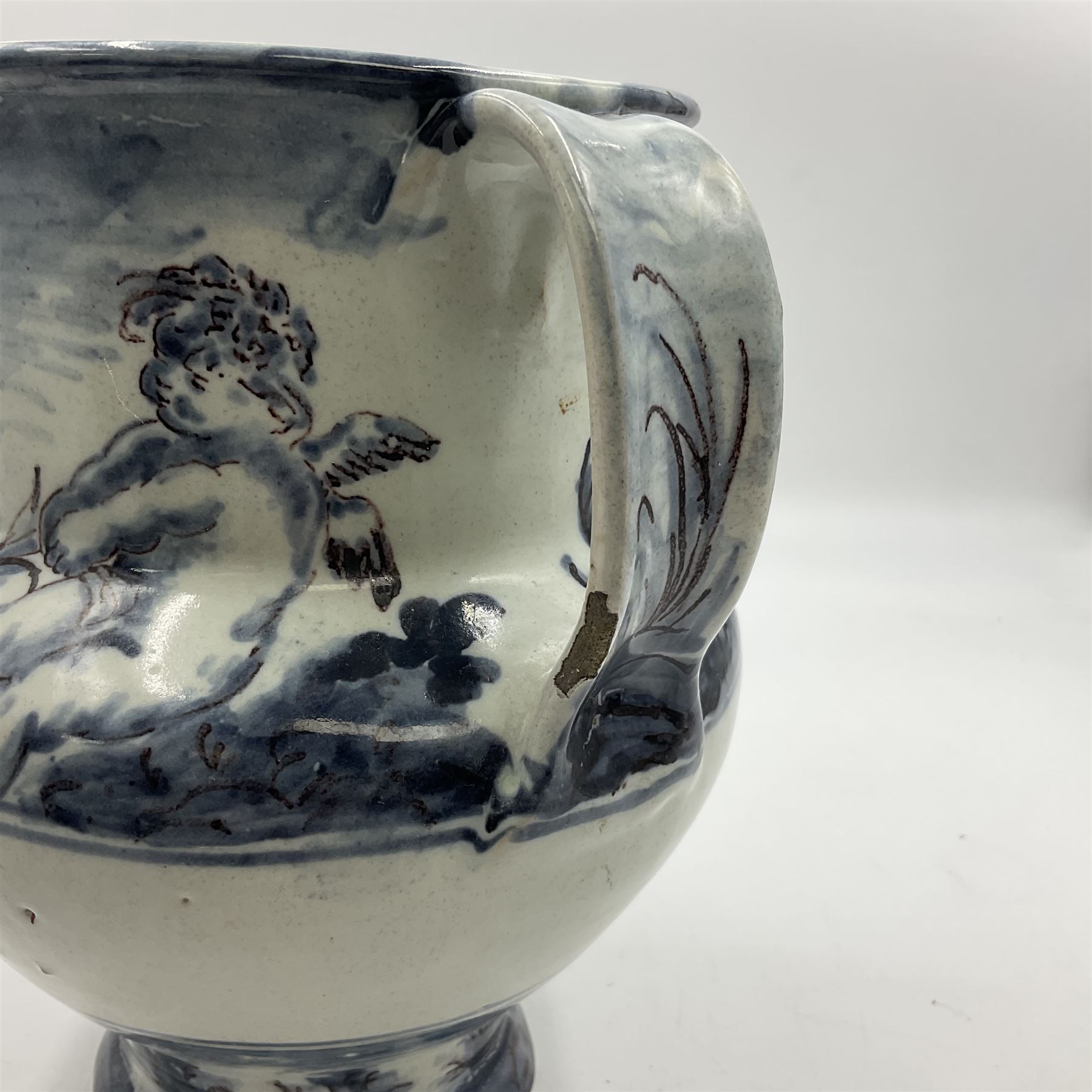 Tin glazed earthenware wet drug jug, decorated with cherubs in a landscape, H90cm 