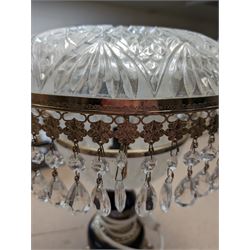 Ceramic table lamp, decorated with florals on a blue ground, with frosted glass shade with glass droplets, with two pin plug