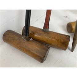 Quantity of croquet equipment, comprising four George G. Bussey mallets, two further smaller mallets, set of six metal hoops and centre post