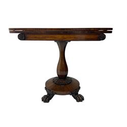 Victorian mahogany tea table, rectangular top with rounded corners, folding and swivelling to reveal interior surface, supported on a faceted baluster-shaped column, raised on a circular platform base with carved acanthus details, ending in four lion paw feet