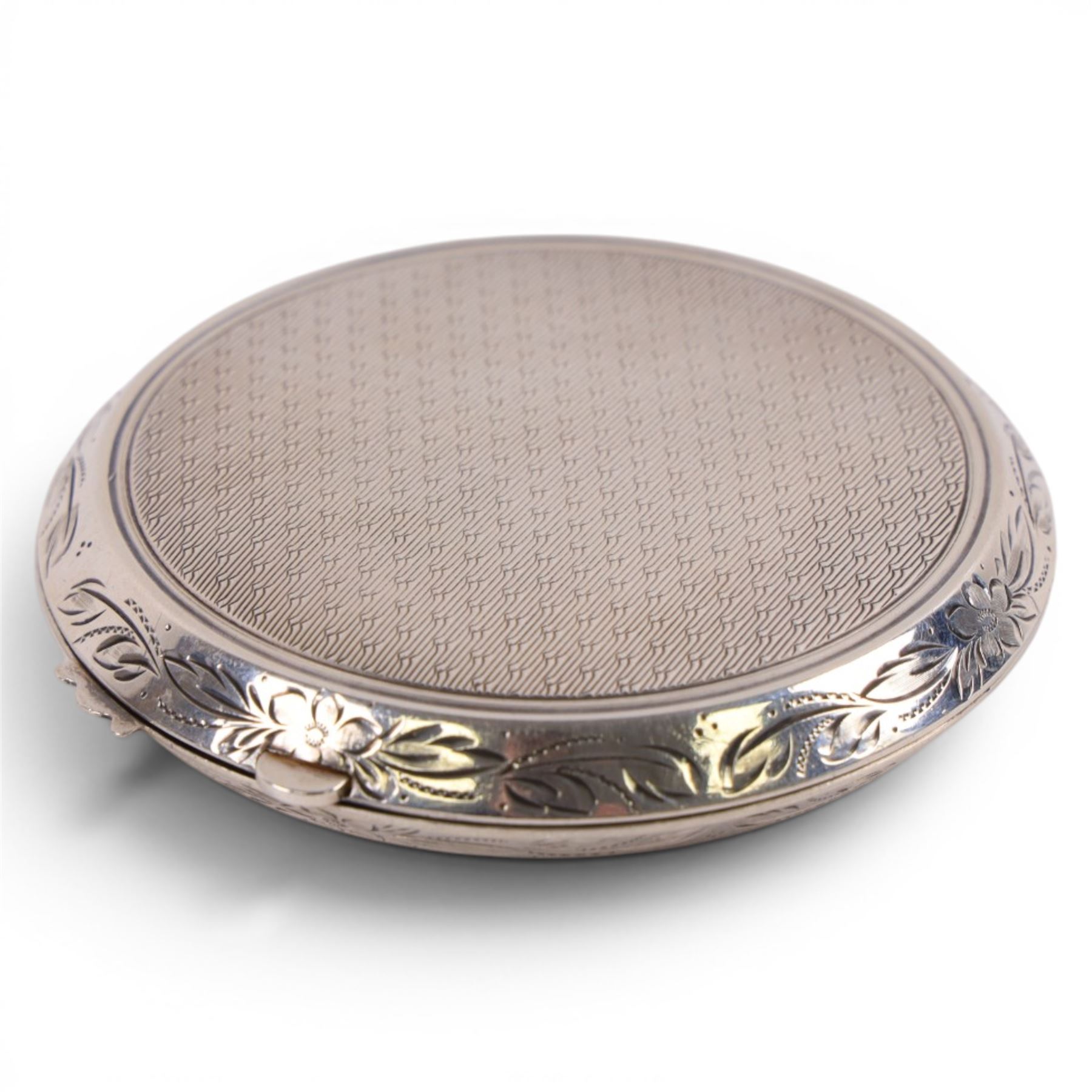 Silver compact mirror, silver handled magnifying glass and a silver-gilt bangle, all hallmarked