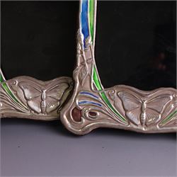 Pair of silver mounted Art Nouveau style photograph frames, with enamel butterfly and floral decoration, with wooden easel stands verso, stamped Sterling, H21cm