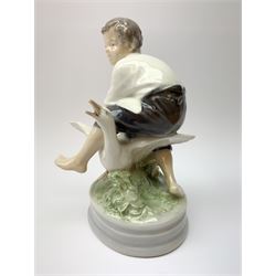 A Royal Copenhagen figure modelled as a boy and two geese, model no 2139, H17cm.
