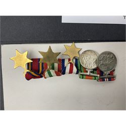 Representative display of WWII Campaign Stars and Medals comprising Burma Star, Italy Star, France & Germany Star, Defence Medal and War Medal 1939-1945; together with the corresponding group of miniatures; all with ribbons