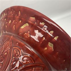 Bretby Jardiniere and stand, with foliate and foliage decoration with a red and yellow ground, impressed mark beneath H94cm