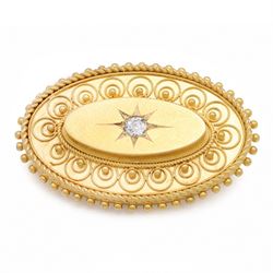 19th / early 20th century gold Etruscan Revival oval brooch, set with a single old cut dia...