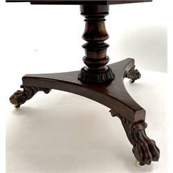 Regency mahogany circular breakfast table, the highly figured segmented veneer top with rosewood band, turned column on platform base with carved paw feet, circular glass top 