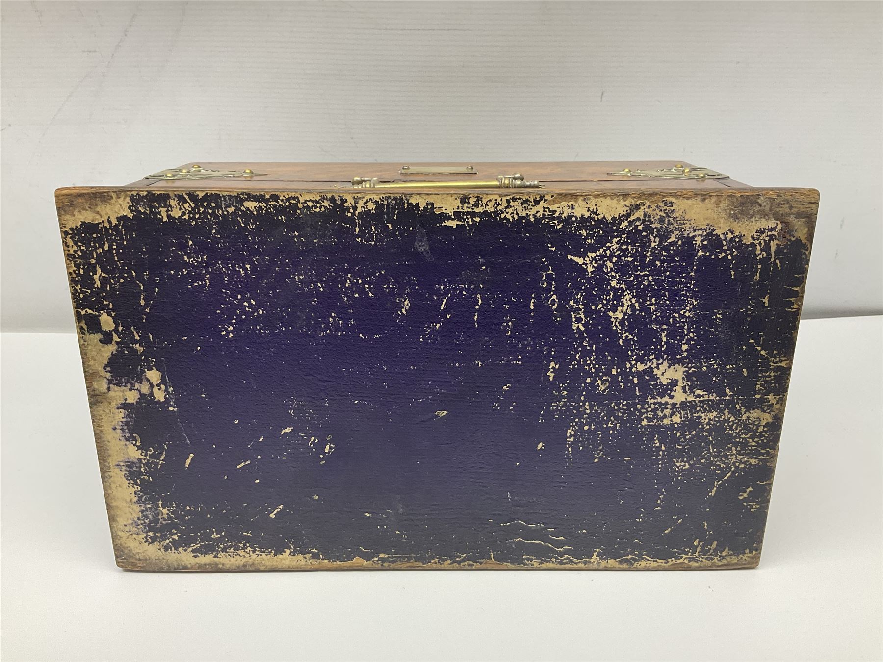 Brass mounted oak humidor, the slide action top opening to a base drawer, cedar lined with central compartment and striker, the drawer stamped Rd 107198, H17cm, D18cm