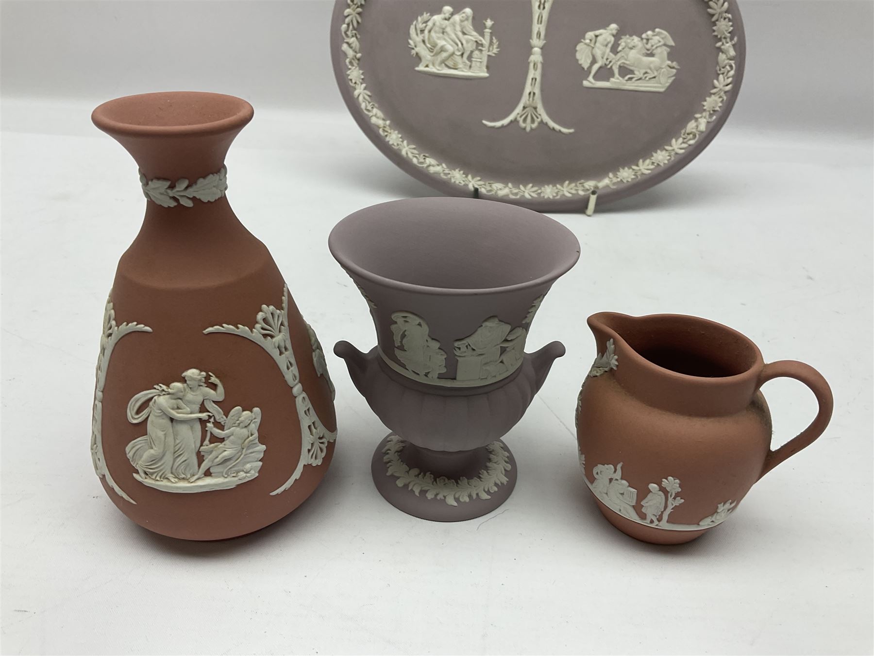 Collection of Wedgwood Jasperware, in orange, lilac and pink colourways, including oval tray, small jug, trinket boxes, trinket dishes, etc , all with impressed mark beneath