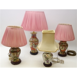  Pair 20th century Cantonese style Famille Rose baluster table lamps with pink pleated shades and hardwood stands and matching table lamp (H65cm including shade) and one other table lamp  